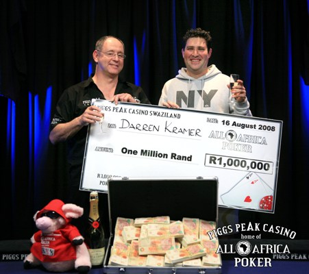 Sandy Koor of Piggs Peak Poker handing over the cheque to Darren Kramer