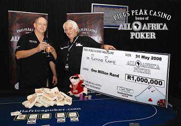 Ray Rahme receiving his cheque for R1 million from Sandy Koor of Piggs Peak